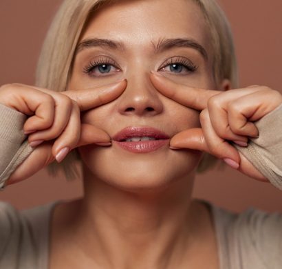 front-view-woman-practicing-facial-yoga